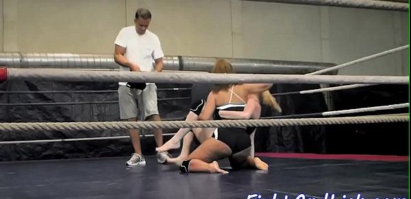  Muscular women wrestling in a boxing ring